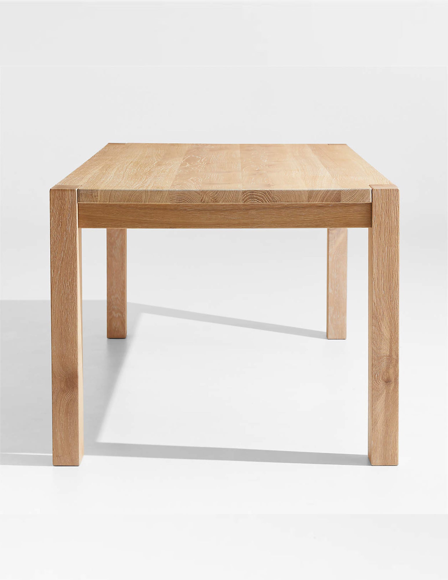 rectangular solid white oak dining table angled view