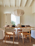 Anthon solid mango wood dining table in modern dining room setting by Immi & Co