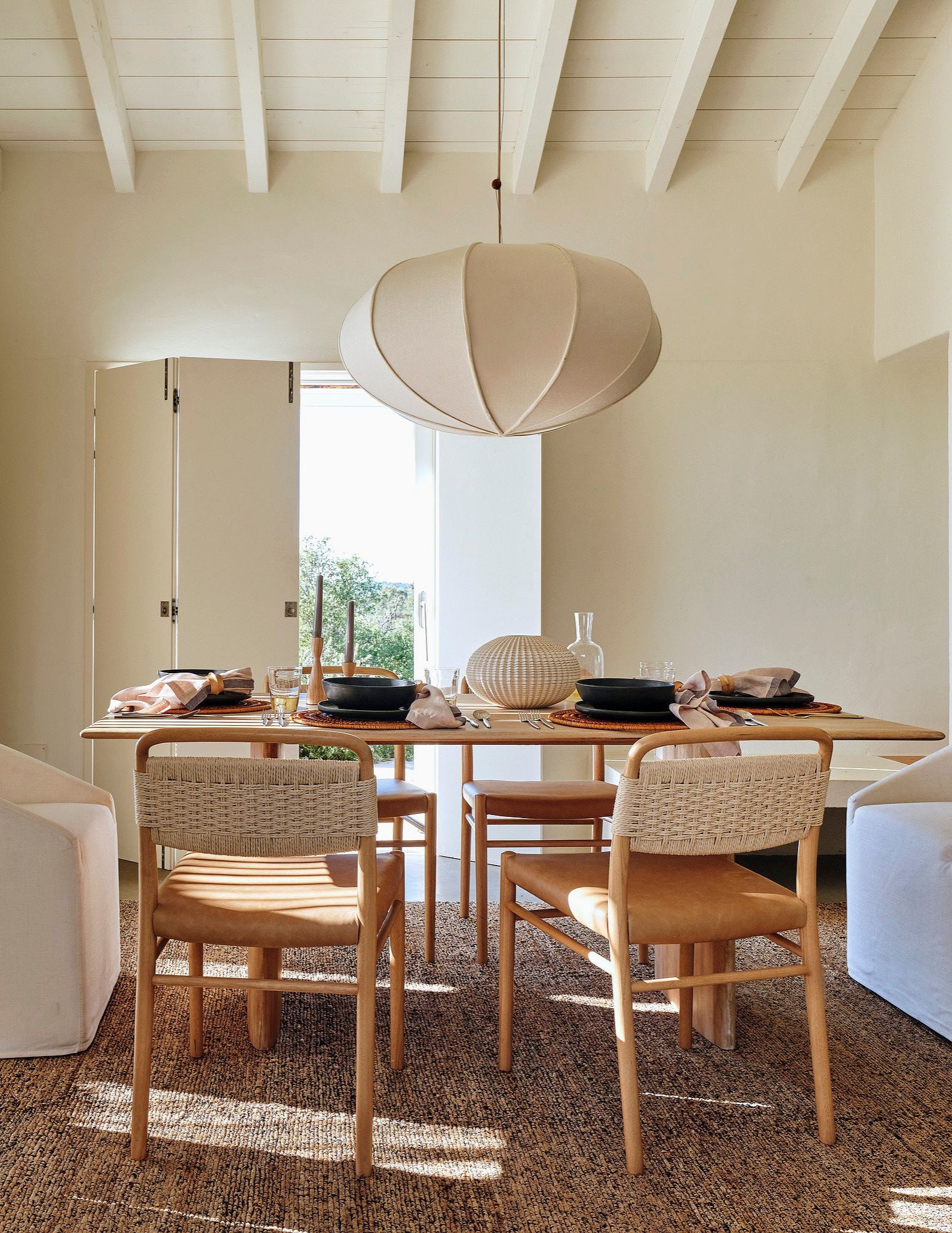 Anthon solid mango wood dining table in modern dining room setting by Immi & Co