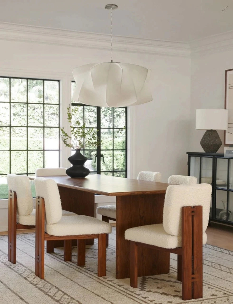 Solid mango wood dining table in bright modern dining space