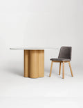 Marble top round dining table with white oak base and chair