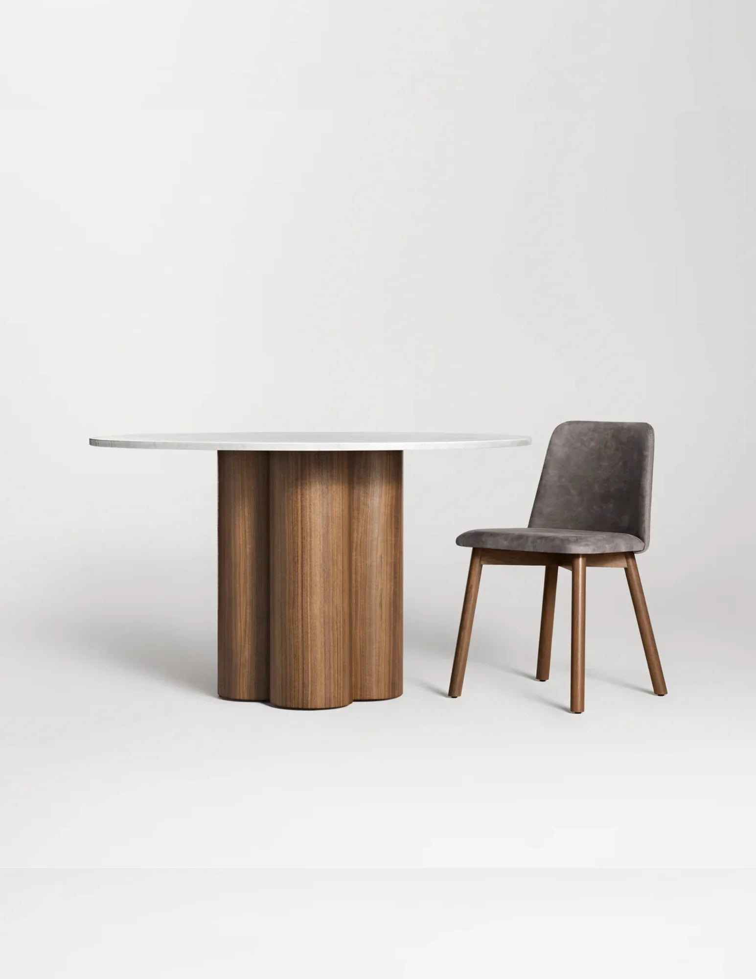Round marble top dining table with chair for scale