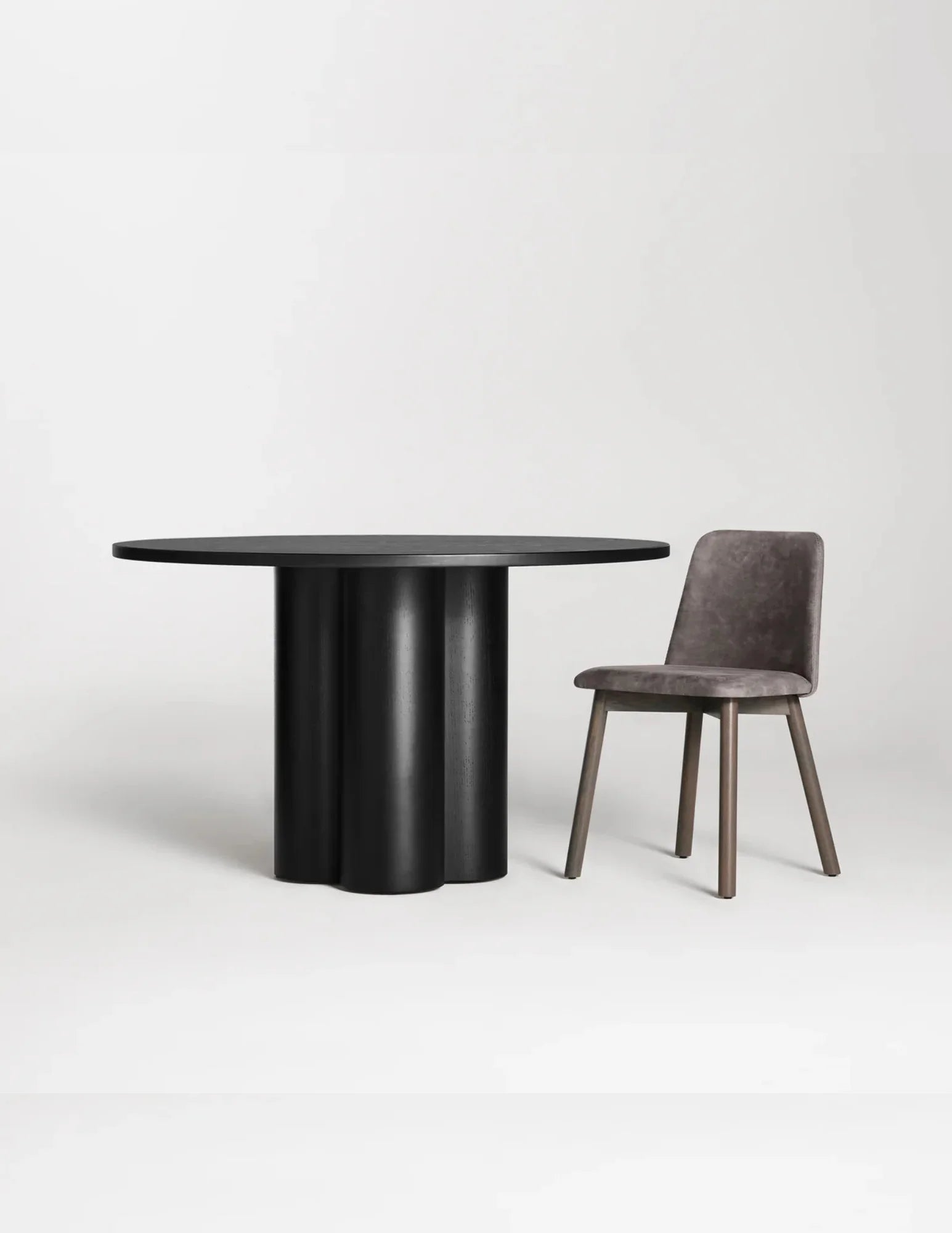 Round wooden dining table with chair for scale black ash finish