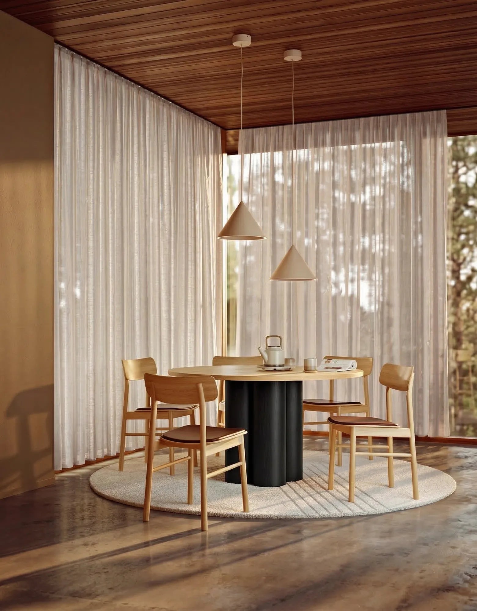 Black ash and natural oak round wooden dining table styled in dining room