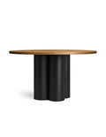 Round wooden table with walnut top and black cylindrical legs angled view
